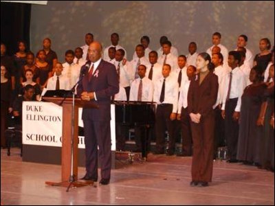 Secretary of Education Rod Paige participates in a September 11th remembrance, with students from the Duke Ellington School of the Arts.