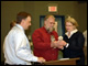 Secretary Spellings and Principal Joe Braach exchange gifts at Shishmaref School in Sishmaref, Alaska.