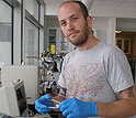 Doctoral student John Chmiola assembling an electrochemical capacitor test cell.