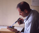 Photo of Peter Ungard taking a dental impression from the teeth of an ancient hominin.