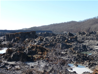 View of Fly Ash Sludge Slide Looking toward Remaining Intact Impoundment Berm.