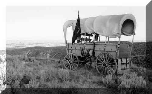 Covered wagon with the sides rolled up.