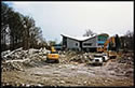 Bulldozer clearing lot of debris