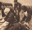 Three women working with military equipment