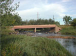 A view of Boulder Creek, CO, at the 75th Street Bridge just downstream of where a wastewater treatment plant discharges effluent into the stream