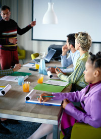 Man instructing a class of students