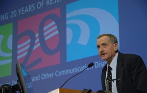 NIDCD Director James F. Battey, Jr., M.D., Ph.D., welcomes participants to the 20th Anniversary Symposium at NIH’s Natcher Conference Center.