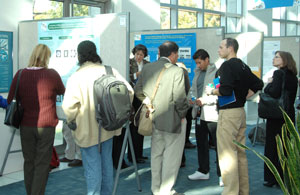 NIDCD intramural scientists discuss their latest research findings with participants during the afternoon poster session.