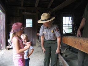 A Junior Ranger candidate interviews a park ranger.