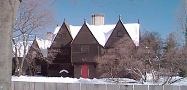 TThe late medieval style mansion house is covered in freshly fallen snow.