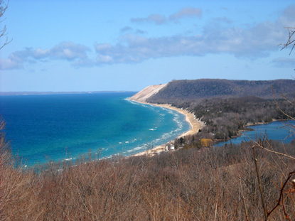 View of the dune face and South Manitou Island. You can also see South Manitou Island Lighthouse in the distance.