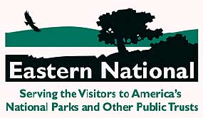 a company logo with green mountains lake and trees with the words Eastern National on it