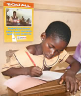 photo A student in Ghana doing her course work. 