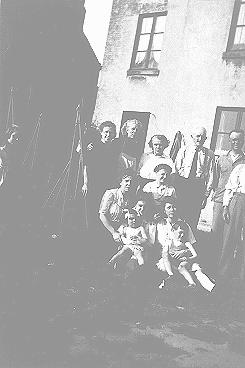 The Anciaux family with Annie and Charles Klein (front), Jewish children whom they sheltered during the war. Brussels, Belgium, between 1943 and 1945.