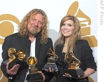 Robert Plant and Alison Krauss hold their Grammys awards in the photo room at the Staples Center in Los Angeles, 08 Feb 2009