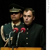 Omar Abdullah (R) takes his oath as new Chief Minister of Jammu and Kashmir state during a ceremony held at the General Zorawar Singh Auditorium in Jammu, 05 Jan 2009