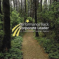 Photo of a pristine trail through the forest with the Performance Track Corporate Leader logo superimposed.