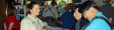 A park volunteer working at the Sunrise Visitor Center.