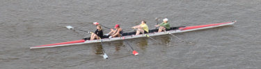 Racing shells and rowers are often seen on the Mississippi River during the summer.