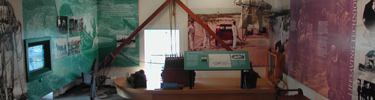 Exhibit panels include artifacts from U. S. Life Saving Service activities.