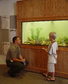 ranger and child at aquarium