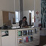 Park ranger works at desk inside a visitor center.