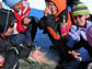 Photo shows group of children with 5000-year-old mud on snowy surface