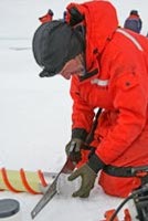 Science: The image representing this topic is a photograph of a man in orange parka taking an ice sample from a glacier or icepack.