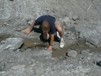 USGS scientists collecting water from Sheep Creek, which drains the San Gabriel Mountains toward the Sheep Creek Fan 