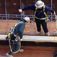 Two workers on a scaffold