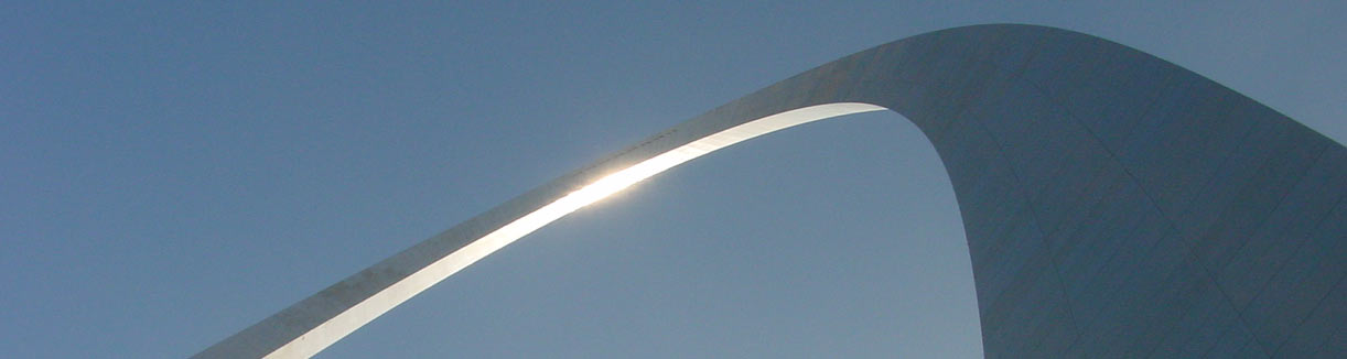 Gateway Arch with sun shining on the stainless steel