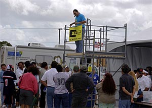 Workers gather around during the hands-on "Scaffolding and Falls" training seminar presented by Iván Alicea from Safway Scaffolds