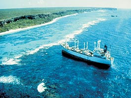 The Fortuna Reefer, a large container ship, is shown aground on the coral reef that surrounds Mona Island off the coast of Puerto Rico.