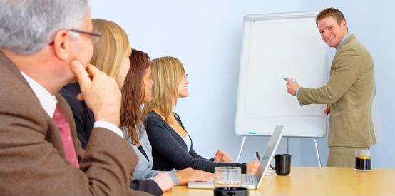 Manager giving presentation in conference room