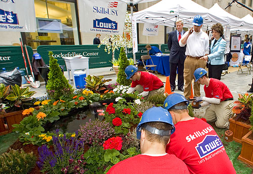 Former-U.S. Secretary of Labor Elaine L. Chao and Former-Assistant Secretary of Labor for Occupational Safety and Health Edwin G. Foulke, Jr. watch SkillsUSA students' landscaping demonstration.