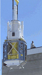 AMWTF Project, April 1, 2002 (Supercompactor Lift): The 62-ton supercompactor was placed through the roof of the Treatment Facility on April 25, 2002.