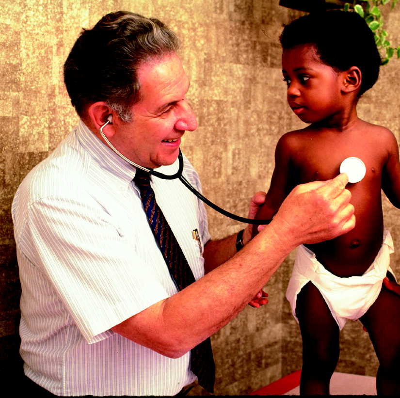 Young child being examined by a doctor.