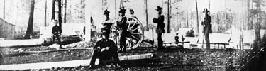 3rd Artillery crew poses with gun.