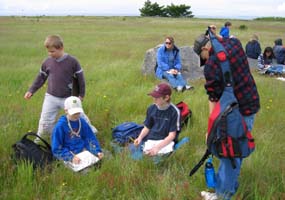 School children learn about prairie habitat on a field trip to the park.