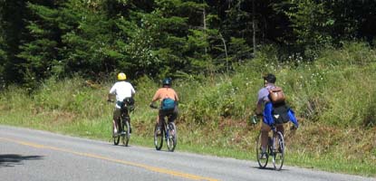 Cyclists pedal along West Valley Road, which runs through English Camp.