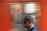 A passenger wearing a protective mask is seen at Mexico's city subway May 6, 2009. REUTERS/Daniel Aguilar