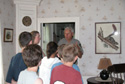 Group on tour inside historic home.