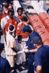 A picture of several migrants on a Coast Guard Cutter.