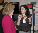 Photo of Deborah Estrin talking with Kathie L. Olsen, W. Lance Haworth and Teresa Kia in back