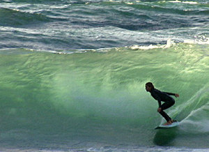 Pro surfer Jenny Flannigan surfing eastern Lake Superior (from Unsalted: Great Lakes Experience)