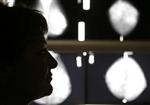 A Greek breast cancer patient, listens to her doctor after a radiological medical examination in an Athens hospital October 29, 2008. REUTERS/Yannis Behrakis