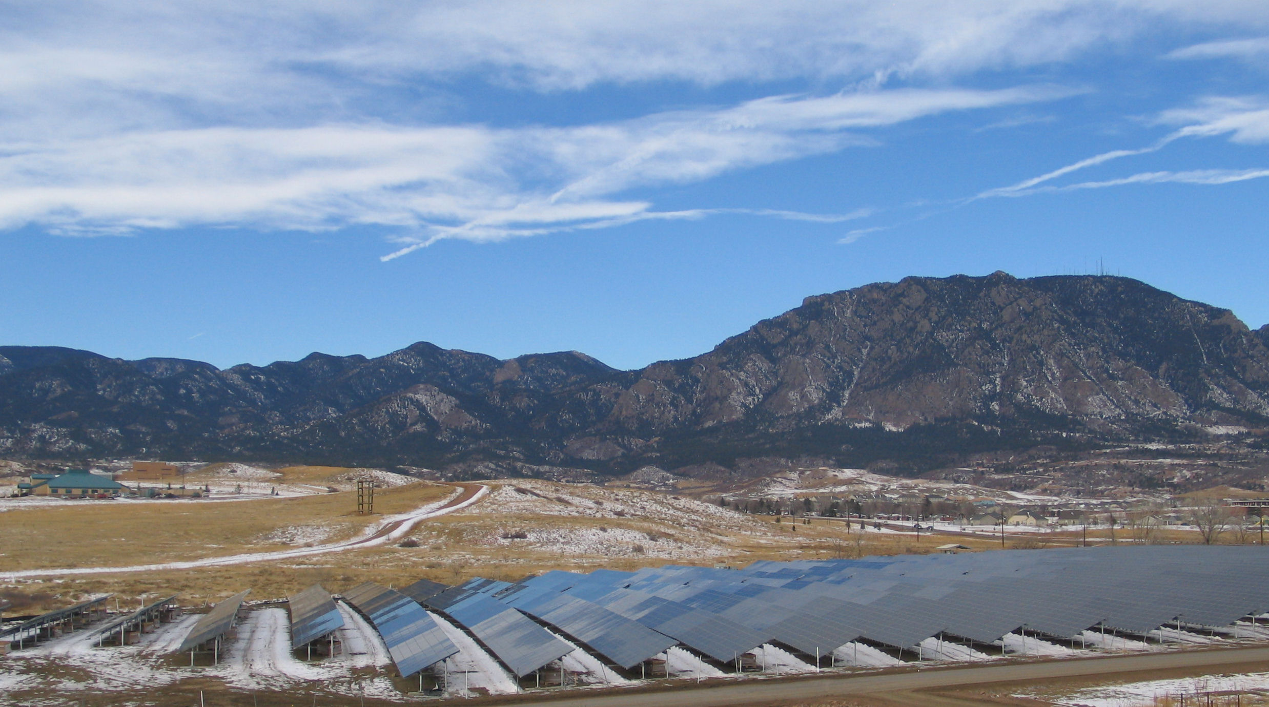 A new, 2-megawatt, ground mounted solar photovoltaic array occupies the site of a former landfill at 