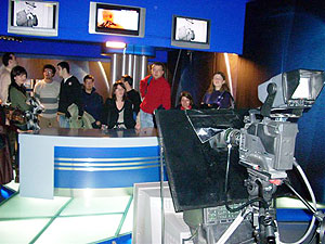 MIM students convene in a TV newsroom.