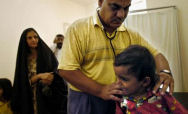 Iraqi doctor examines young girl