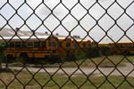 New Orleans, LA - School busses sit abandoned in a lot in the Lower 9th Ward / Desire St. Community (New Orleans, LA).  More than 35,000 national service participants contributed more than 1.6 million hours of volunteer service during the first year of hurricane relief and recovery efforts along the Gulf Coast, according to a report released on August 25, 2006 by the Corporation for National and Community Service.